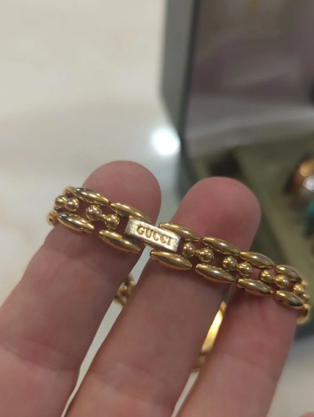 Gucci Gold Bracelet Watch with Blue Bezel and Multi-Color Interchangeable Bezels